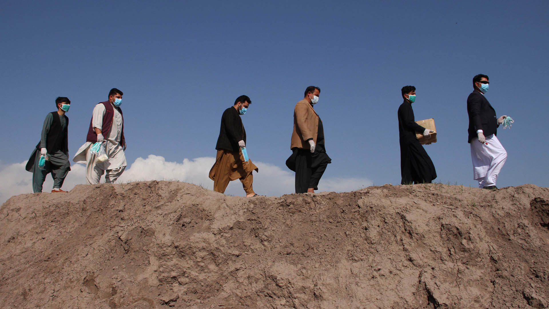 Members of the Tawaan Foundation distribute face masks, gloves, and disinfectants to villagers to spread awareness of Covid-19 in Jalalabad, Afghanistan on March 18, 2020.