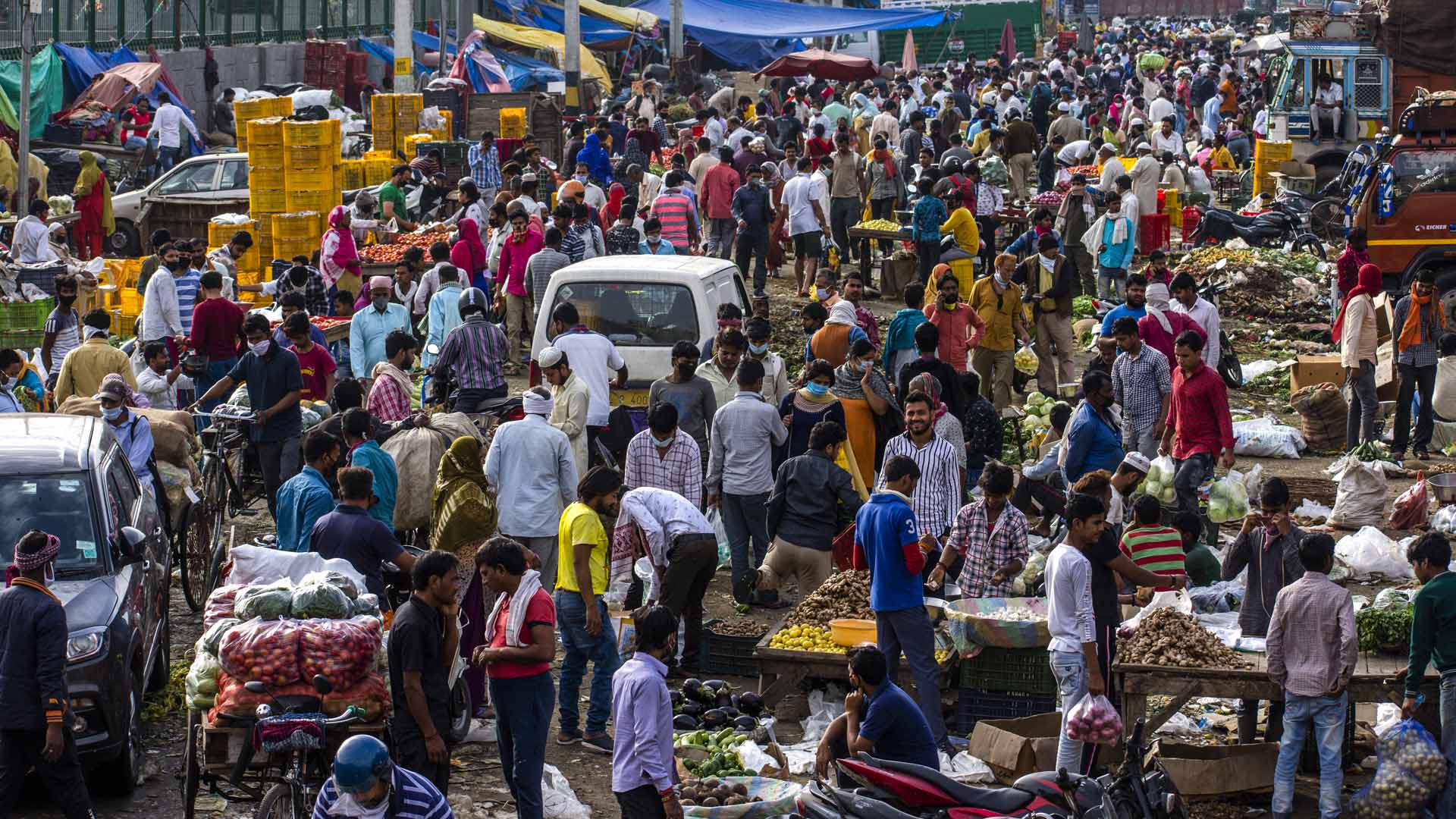 Shopkeepers and customers in a crowded marketplace in New Delhi, India on March 26, 2020.