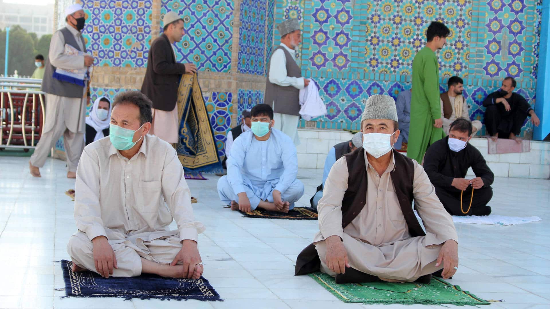 Worshippers wear protective face masks as they gather to perform the Eid al-Fitr prayer in Kabul, Afghanistan in May 2020.