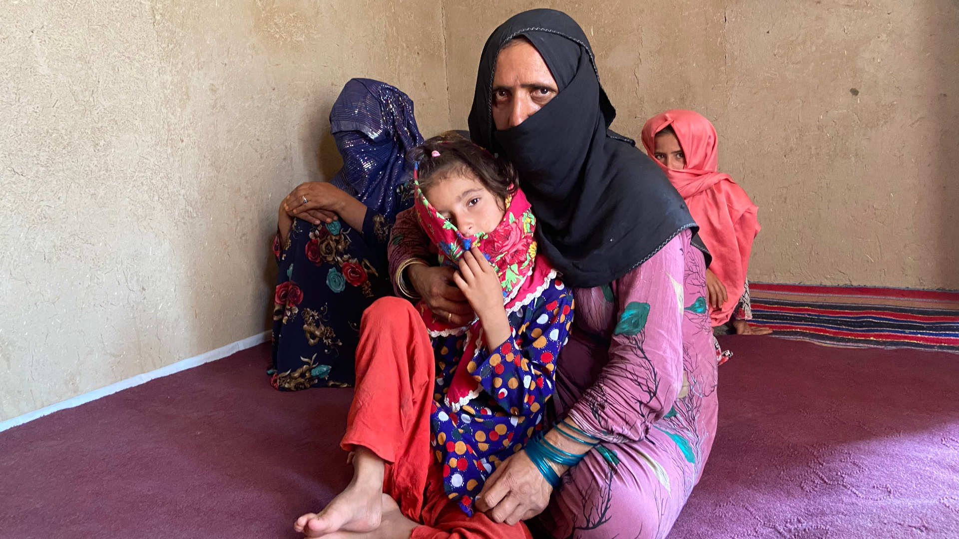Facing extreme poverty, Rabia agreed to offer her elder daughter, Shukria (far right, background) for marriage in exchange for food and cash.